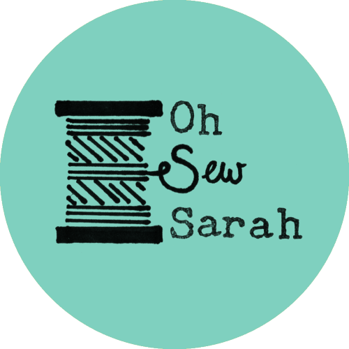 Illustration of a cotton bobbin with some wording next to it. The thread spells our the word 'Sew'. Some old typewriterlettering completes the message 'Oh Sew Sarah'.